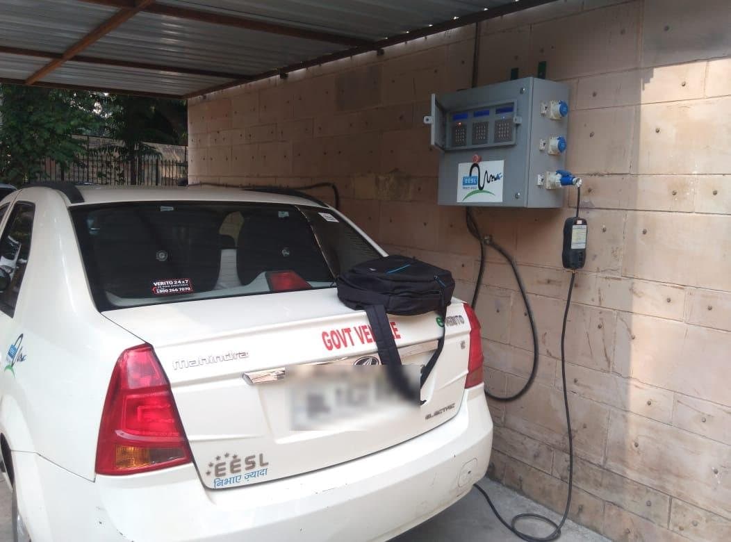 Government electric car charging from a wall-mounted three-socket EVIT charger