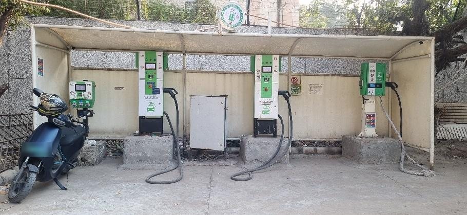EVIT chargers under a shelter at a public charging station in Delhi